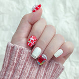 short round christmas nails in checker sstyler and hv gems on it
